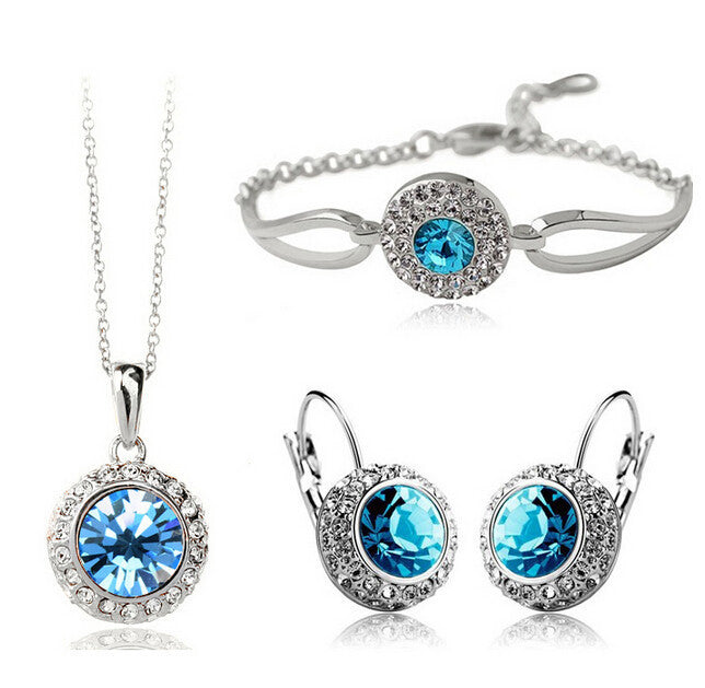 Parure argentée à cristal rose : collier, boucles d'oreilles et bracelet