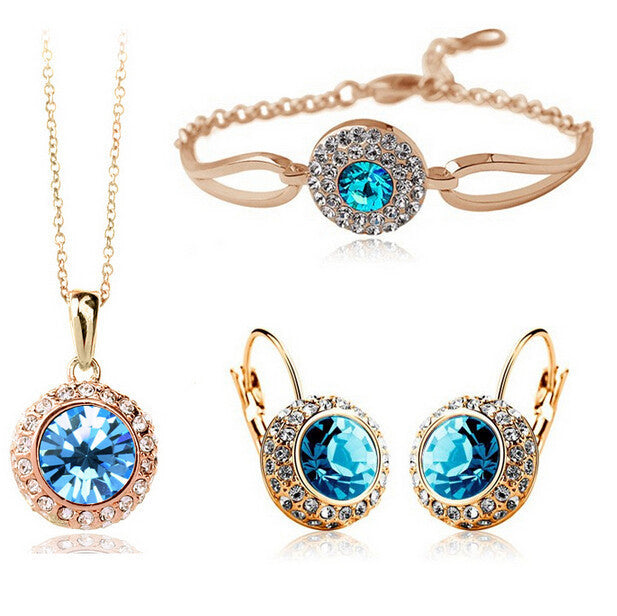 Collier et bracelet dorés à cristal violet