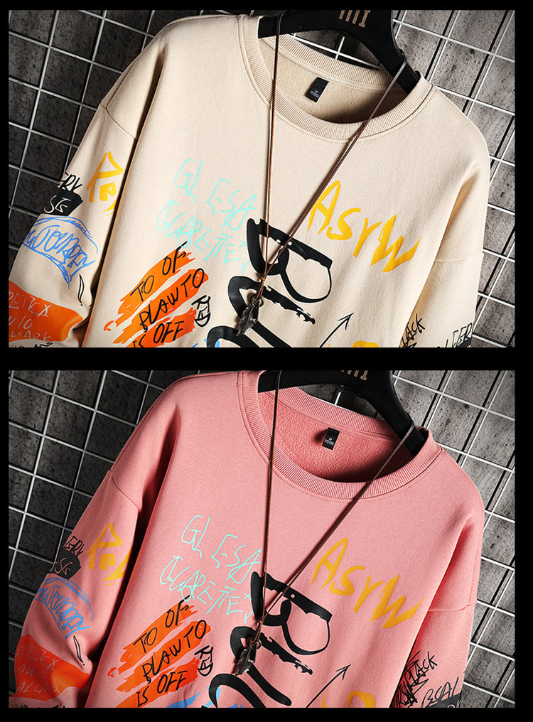 Sweat col rond à imprimé graffiti, coloris beige et rose côte à côte