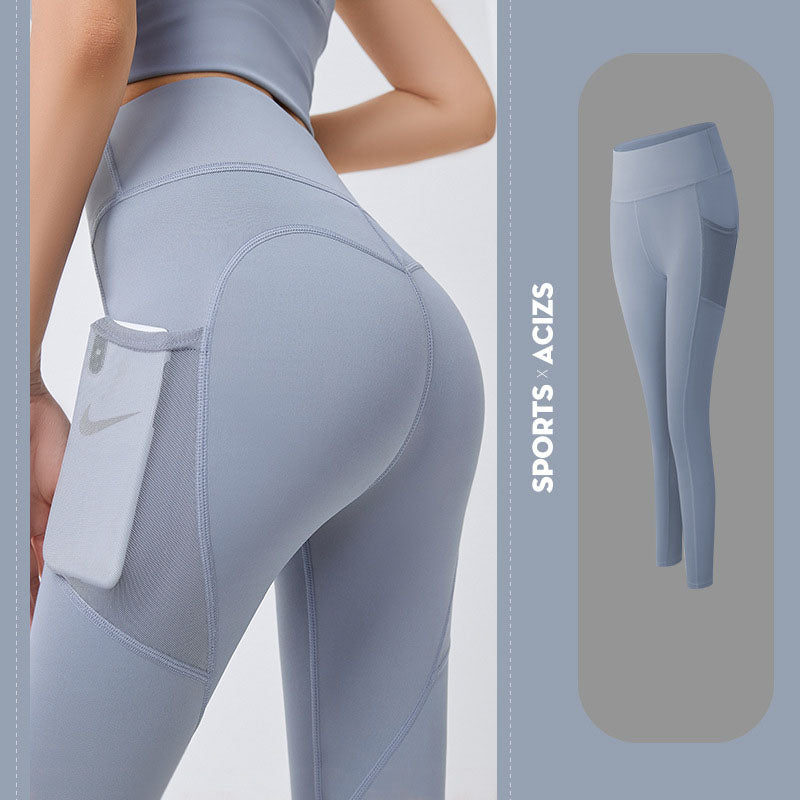 Legging sport violet à poche filet, téléphone glissé dans la poche